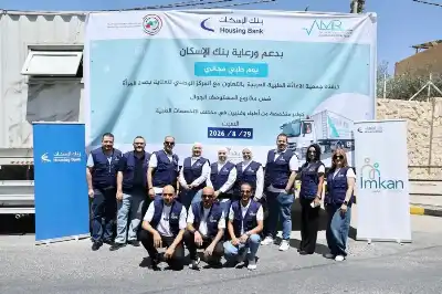 متطوعو إمكان الإسكان يشاركون في اليوم